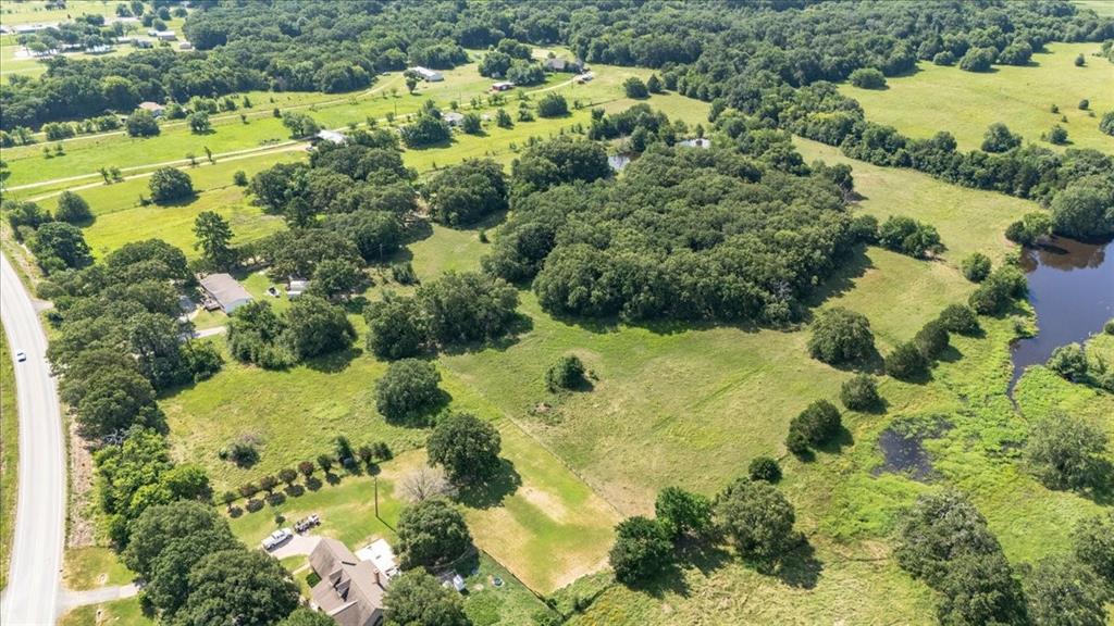 Part) Lot 4 Fm 2451 Scurry, TX 75158 - Photo 7 of 11 a view of a garden with a lake