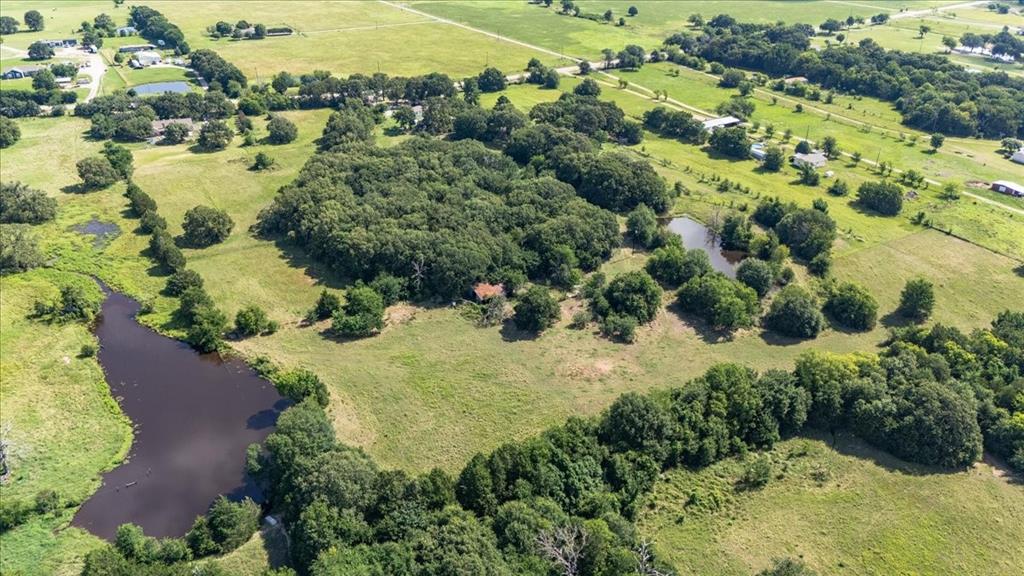 Part) Lot 4 Fm 2451 Scurry, TX 75158 - Photo 8 of 11 an aerial view of residential houses with outdoor space