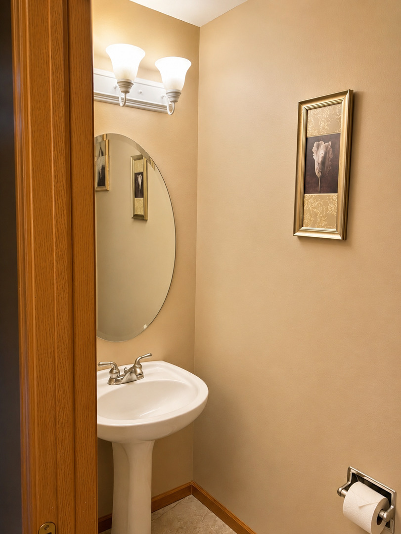 720 Ridge Drive Marengo, IL 60152 - Photo 13 of 34 a bathroom with a sink mirror and toilet
