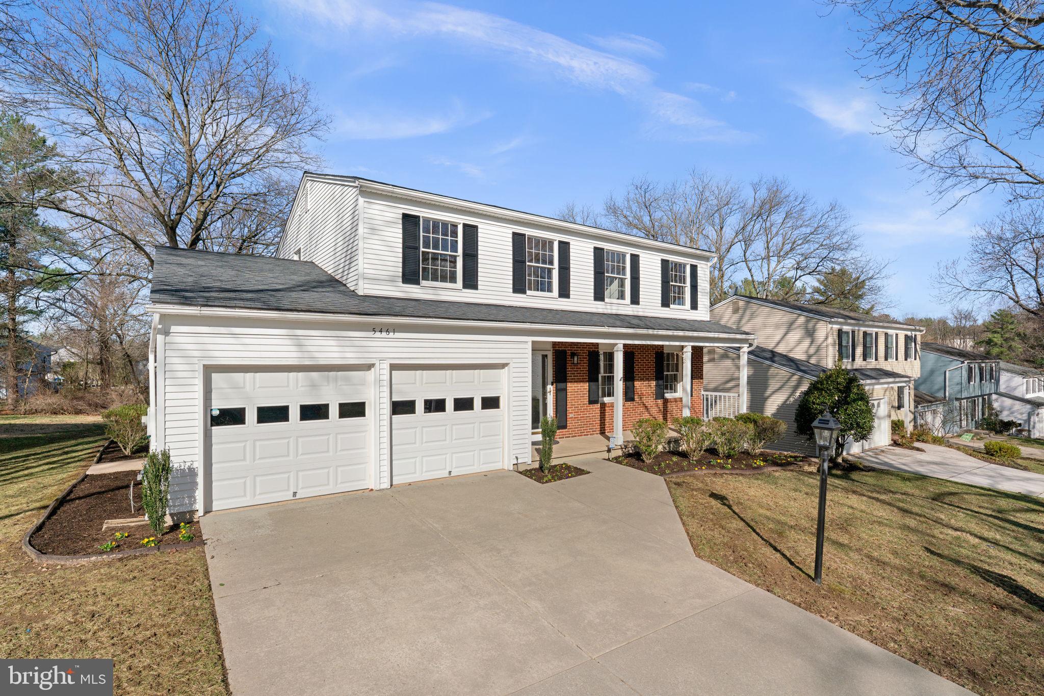 5461 Marsh Hawk Way Columbia, MD 21045 - Photo 2 of 48 a front view of a building with large windows