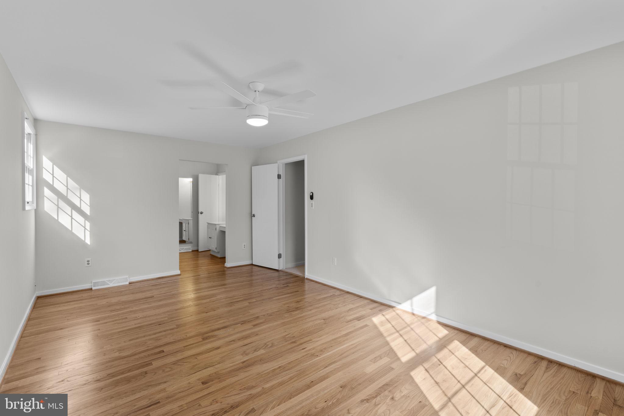 5461 Marsh Hawk Way Columbia, MD 21045 - Photo 21 of 48 a view of an empty room with wooden floor