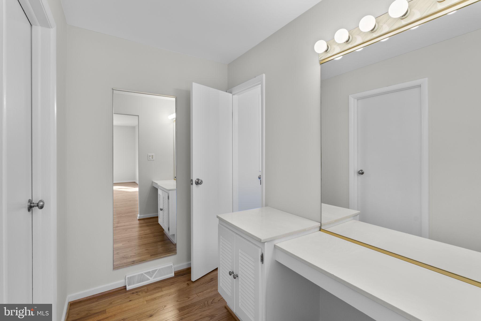 5461 Marsh Hawk Way Columbia, MD 21045 - Photo 22 of 48 a bathroom with a sink and a mirror