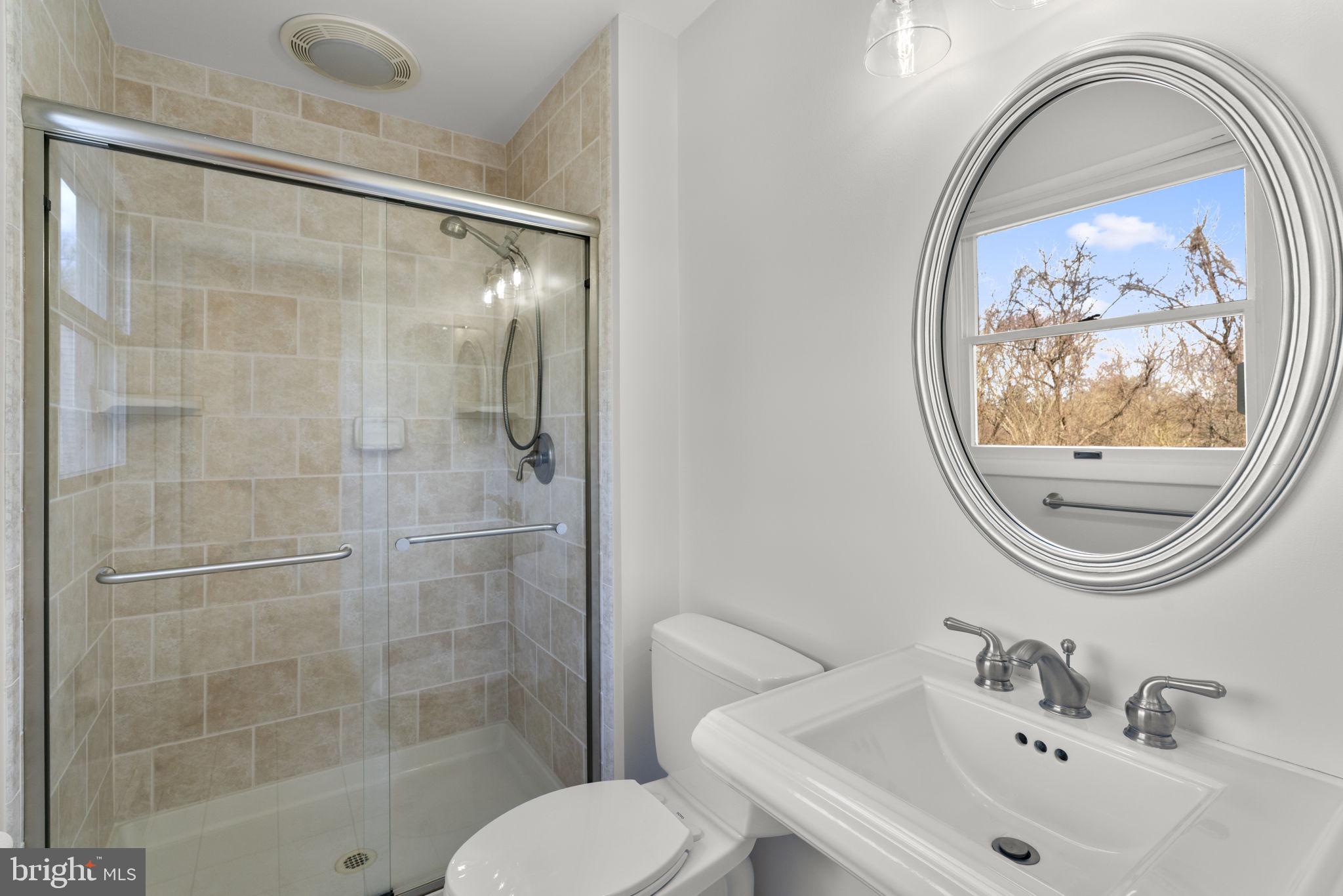 5461 Marsh Hawk Way Columbia, MD 21045 - Photo 23 of 48 a bathroom with a sink and a mirror