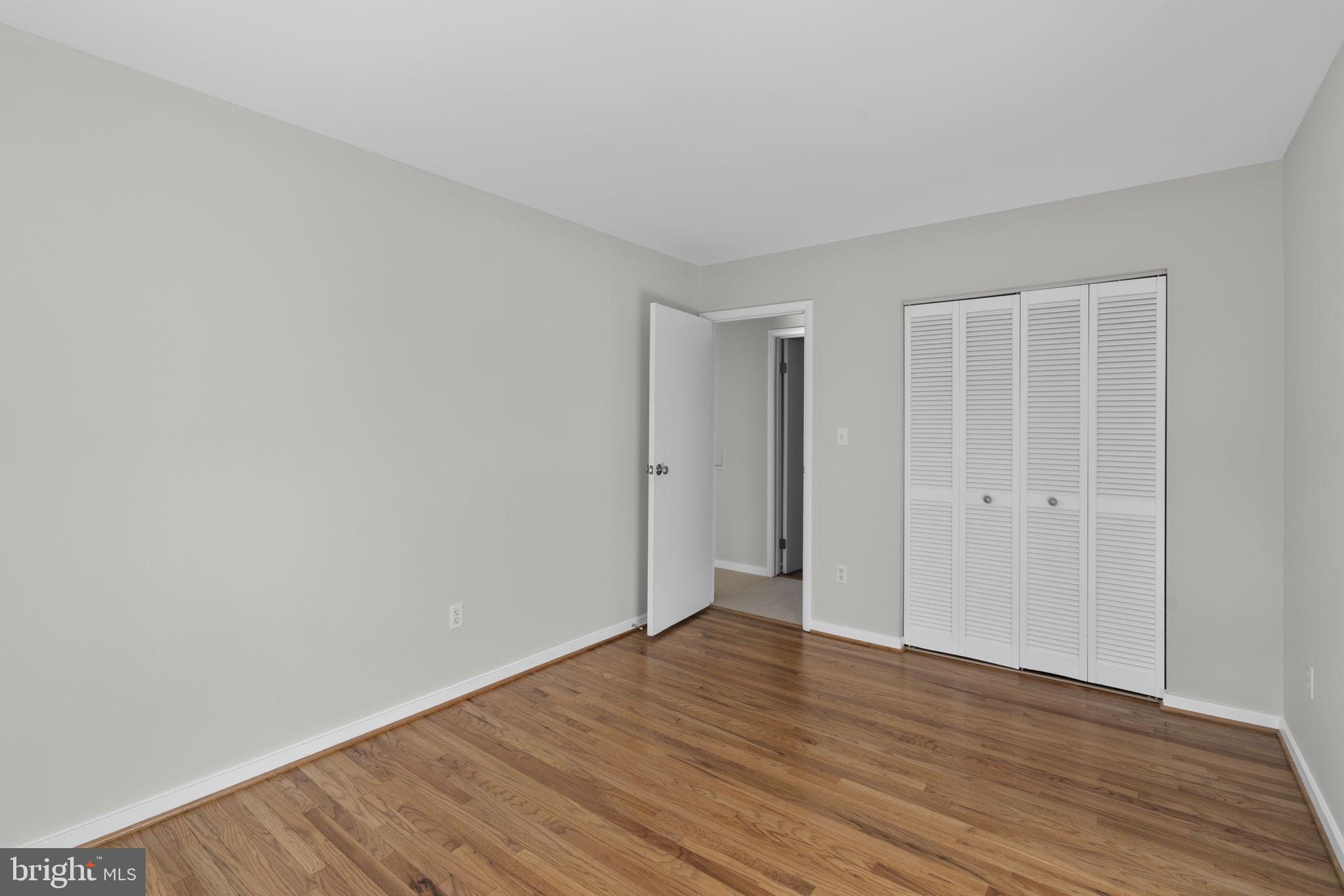 5461 Marsh Hawk Way Columbia, MD 21045 - Photo 28 of 48 a view of an empty room with wooden floor
