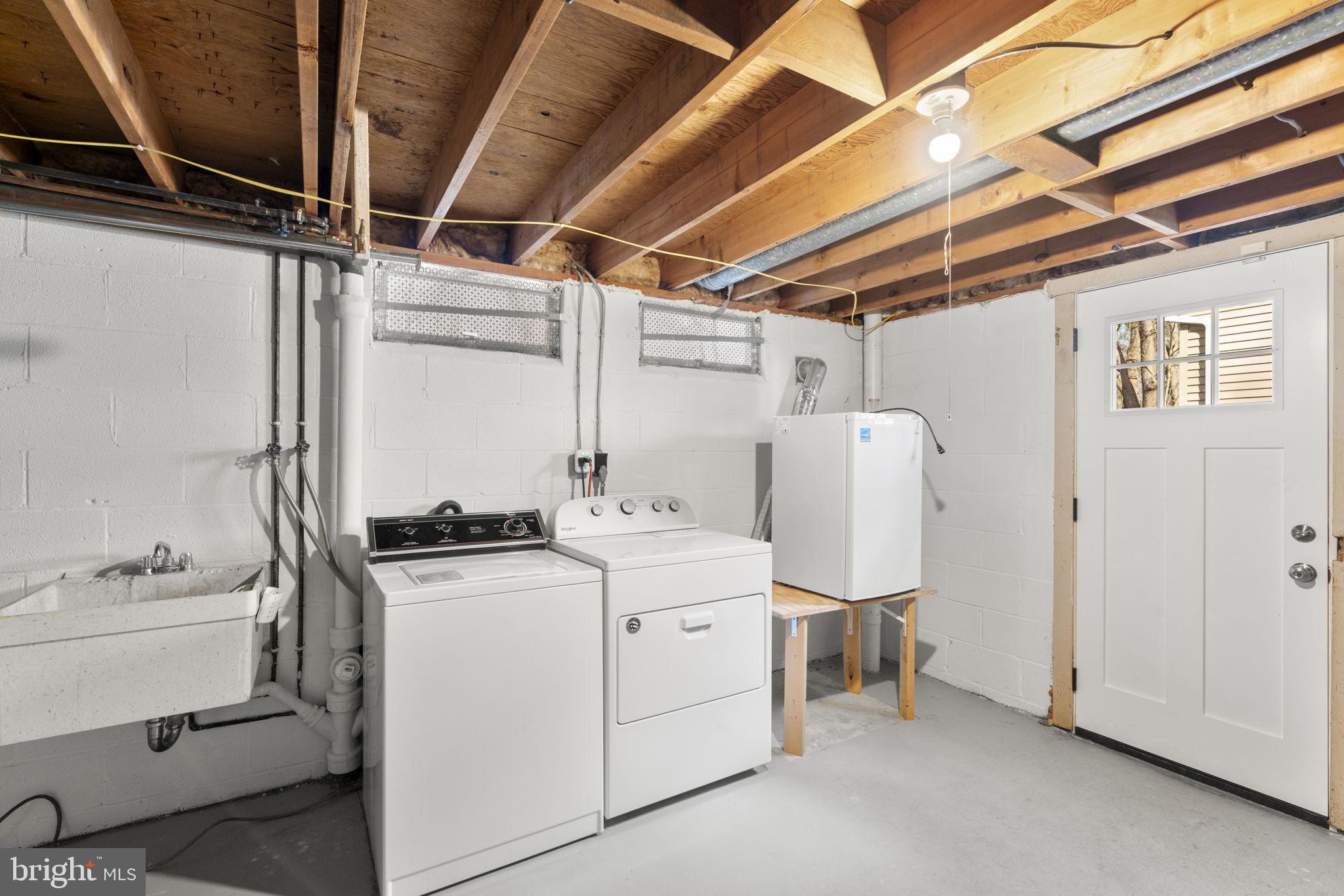 5461 Marsh Hawk Way Columbia, MD 21045 - Photo 34 of 48 a utility room with dryer and washer