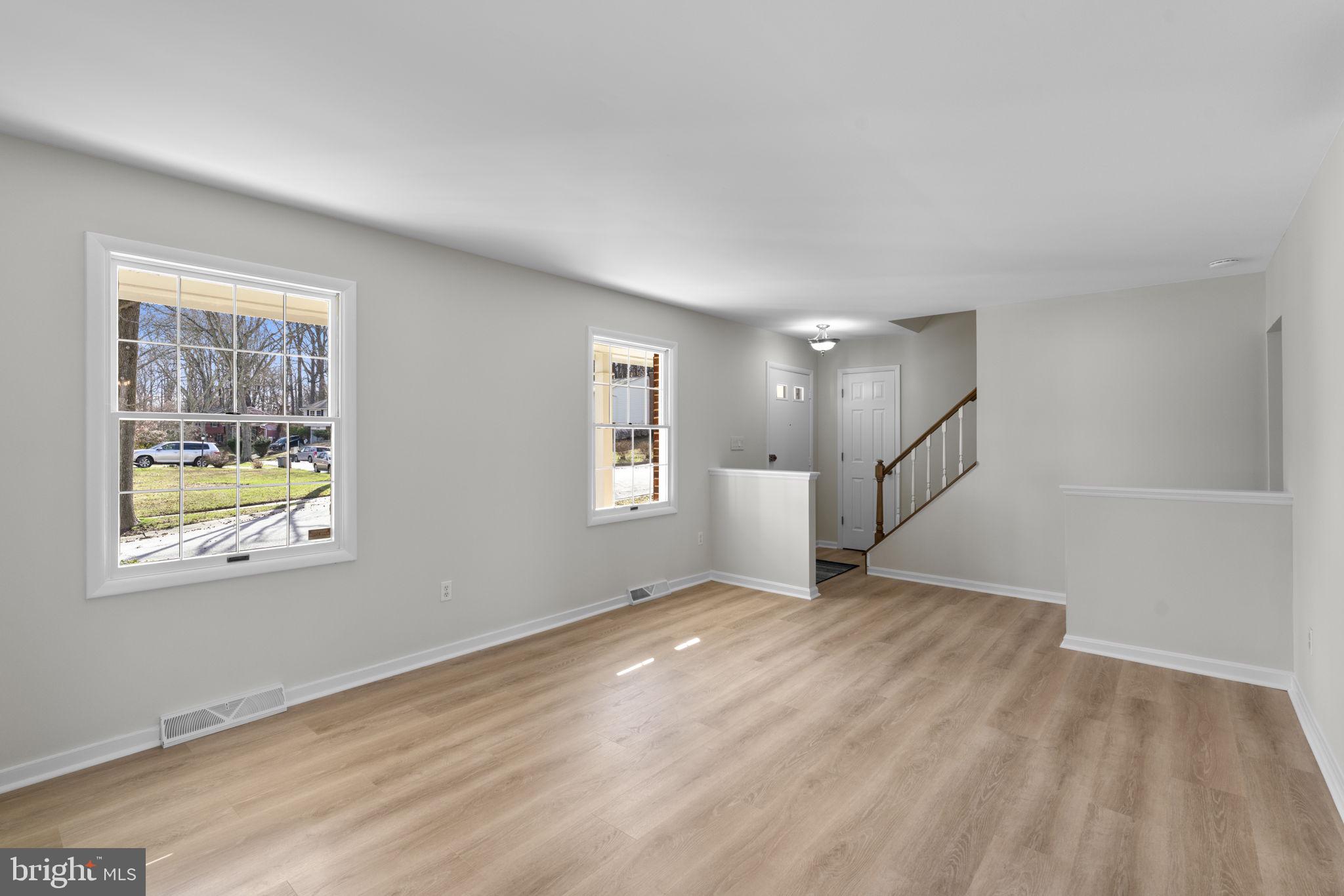 5461 Marsh Hawk Way Columbia, MD 21045 - Photo 4 of 48 wooden floor in an empty room with a window