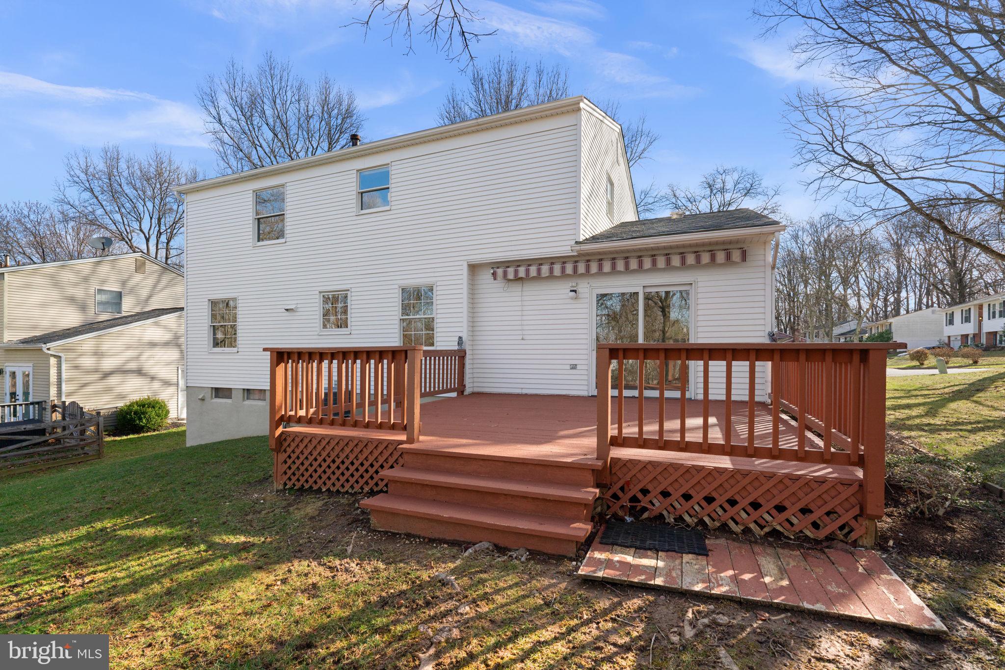5461 Marsh Hawk Way Columbia, MD 21045 - Photo 38 of 48 a view of a house with a wooden deck