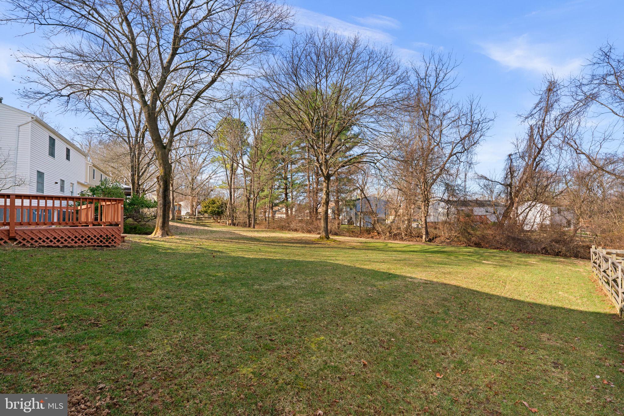 5461 Marsh Hawk Way Columbia, MD 21045 - Photo 41 of 48 a view of yard with large tree and wooden fence