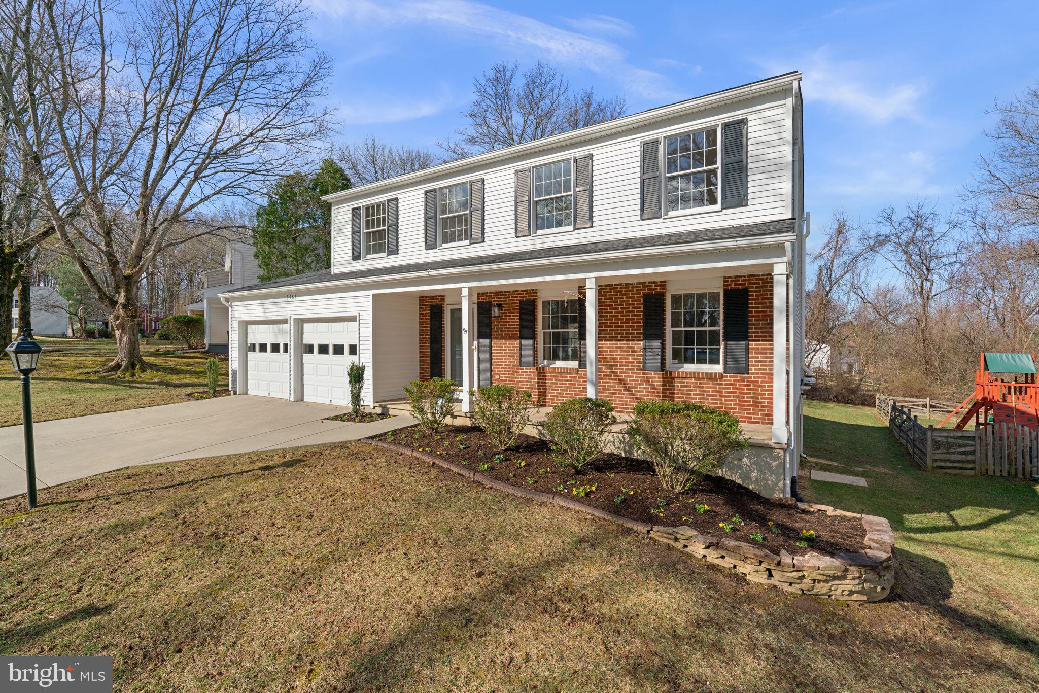 5461 Marsh Hawk Way Columbia, MD 21045 - Photo 44 of 48 a front view of a house with garden