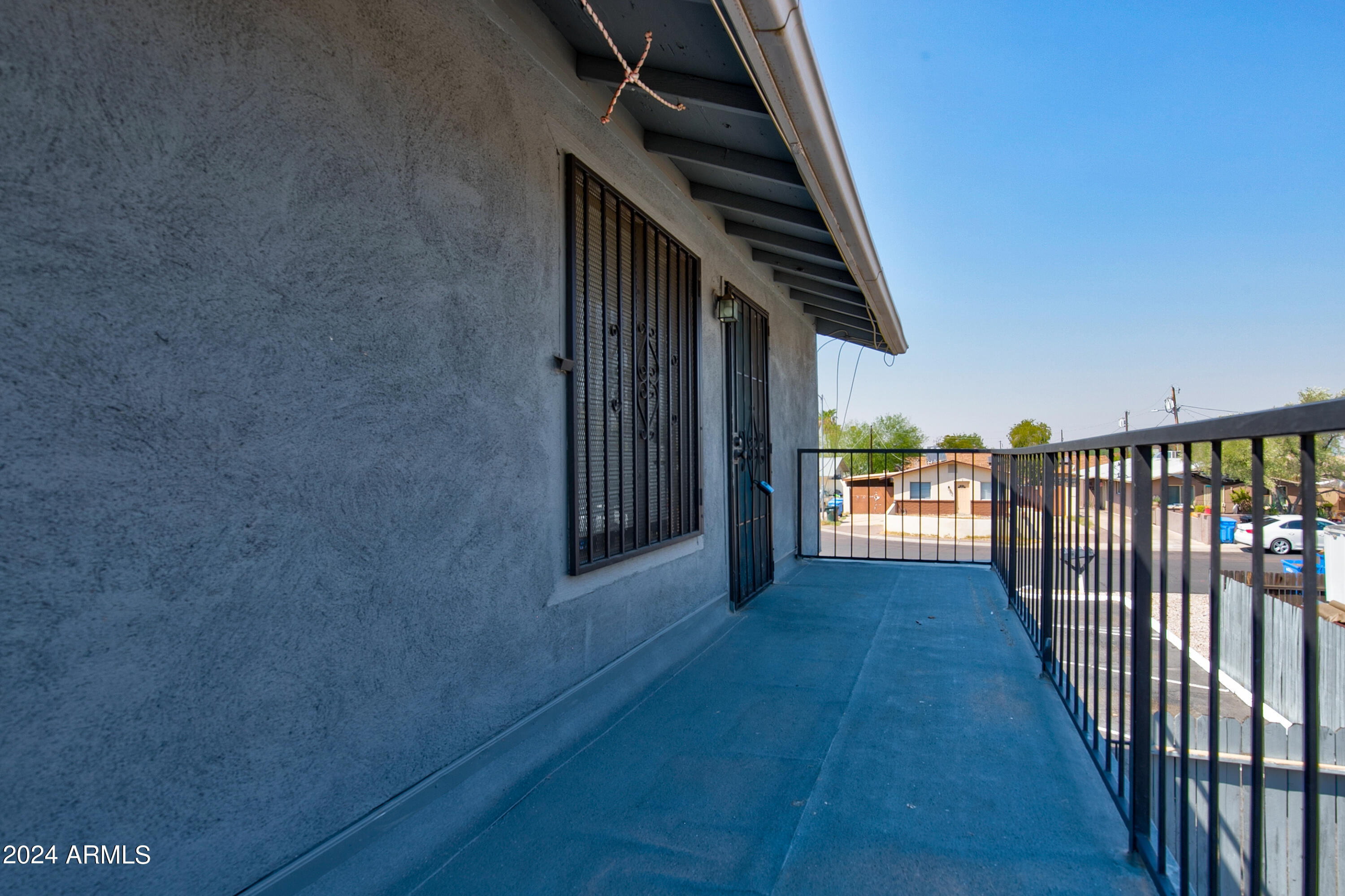 9631 North 12th Avenue, Unit 201 Phoenix, AZ 85021 - Photo 2 of 32 a view of hallway with wooden floor and stairs