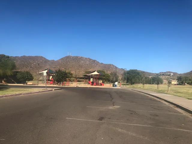 a view of street and houses with outdoor space
