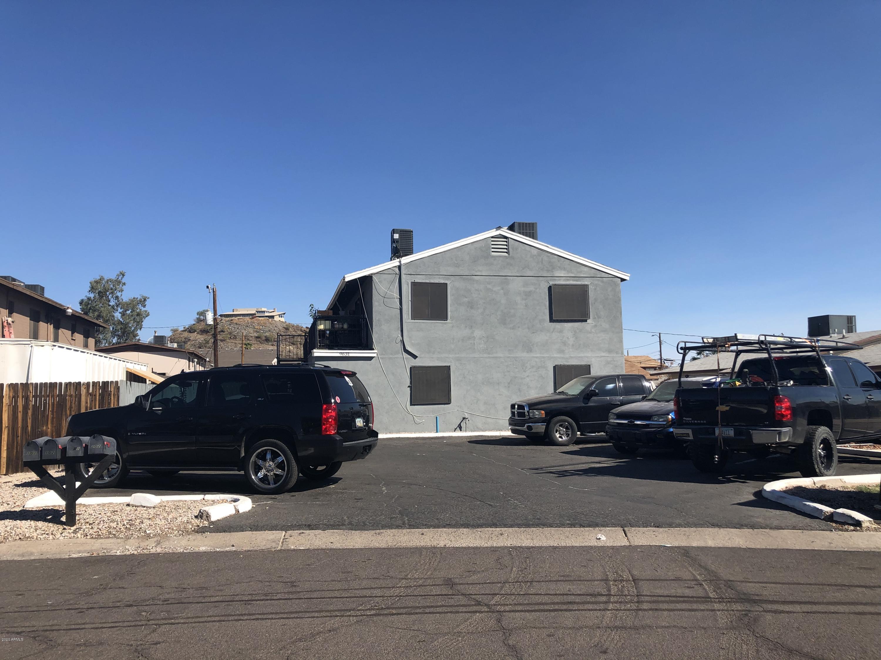 9631 North 12th Avenue, Unit 201 Phoenix, AZ 85021 - Photo 26 of 32 a car parked in front of a house