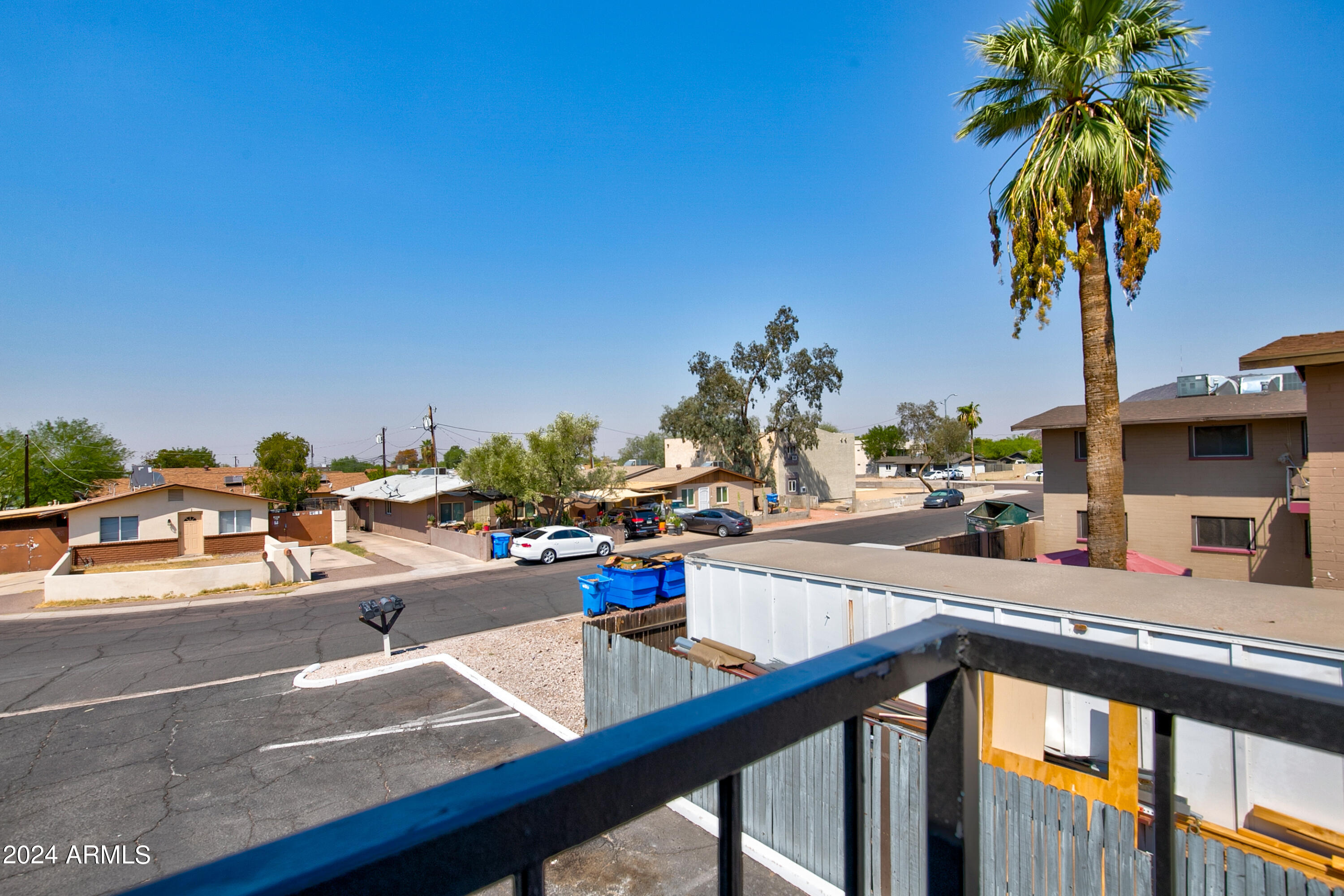 9631 North 12th Avenue, Unit 201 Phoenix, AZ 85021 - Photo 4 of 32 a view of a swimming pool from a balcony