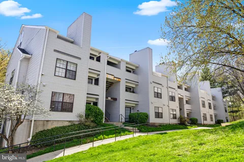 a large building with a yard in front of it
