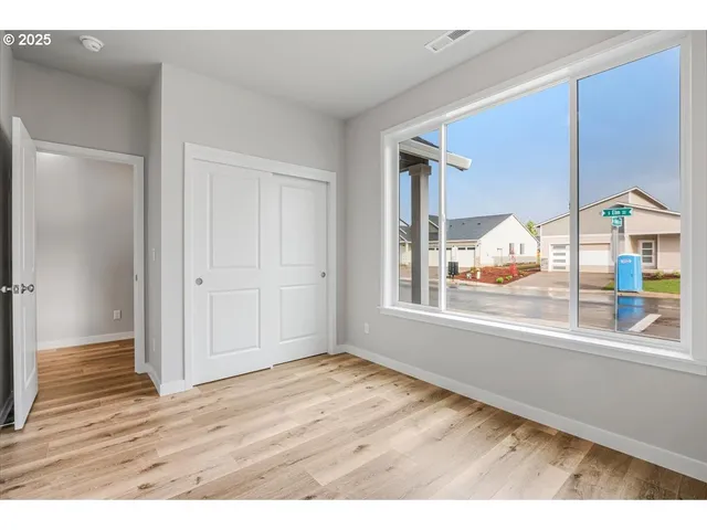 a kitchen with granite countertop a stove top oven a sink a counter space and cabinets