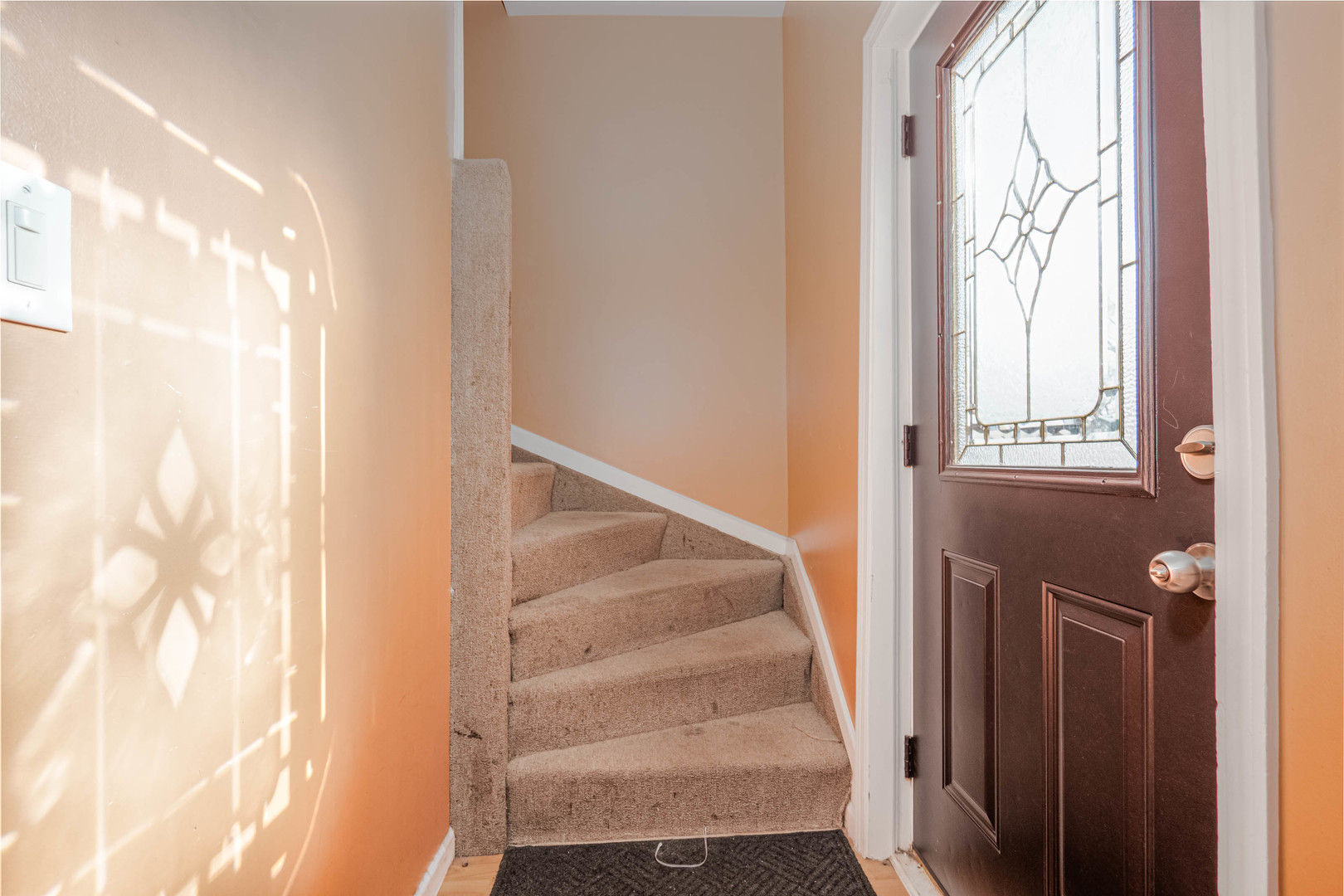 4910 West Walton Street Chicago, IL 60651 - Photo 13 of 27 a view of a staircase with wooden floor and a window