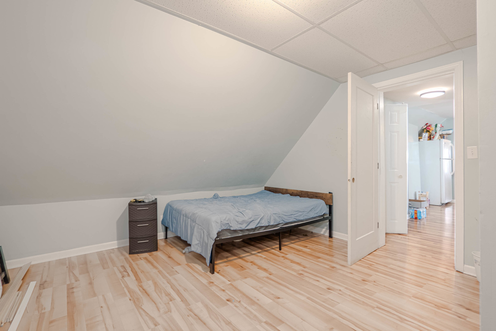4910 West Walton Street Chicago, IL 60651 - Photo 20 of 27 a bedroom with a bed and wooden floor
