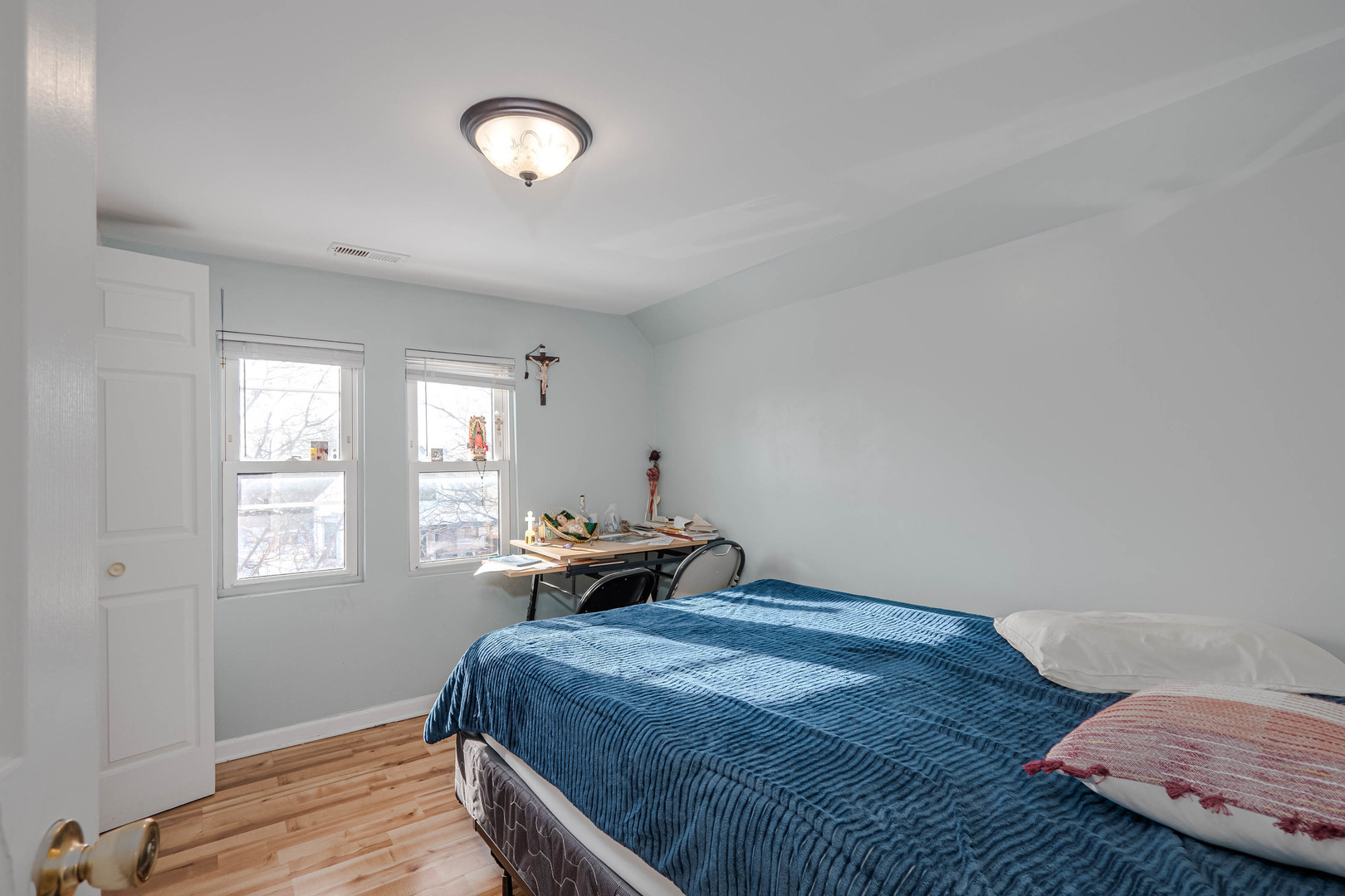 4910 West Walton Street Chicago, IL 60651 - Photo 21 of 27 a bedroom with a bed and a window