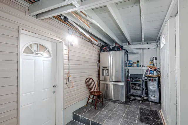 a bathroom with a sink and mirror with toilet