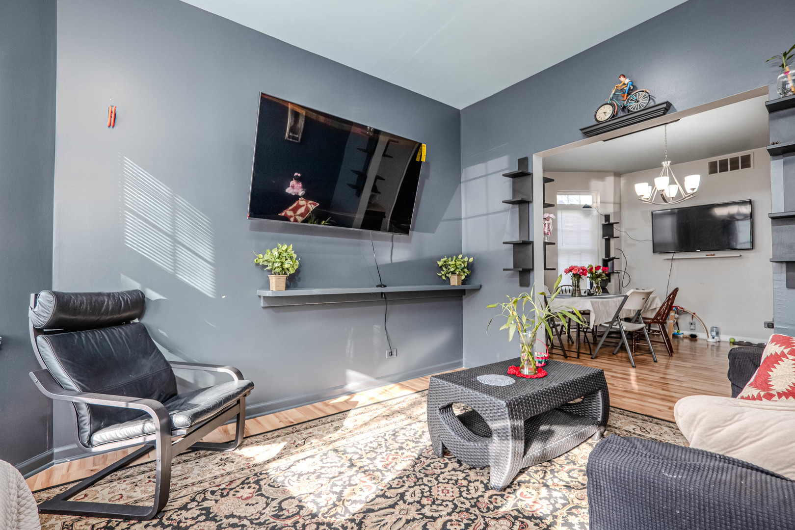 4910 West Walton Street Chicago, IL 60651 - Photo 3 of 27 a living room with furniture and a flat screen tv
