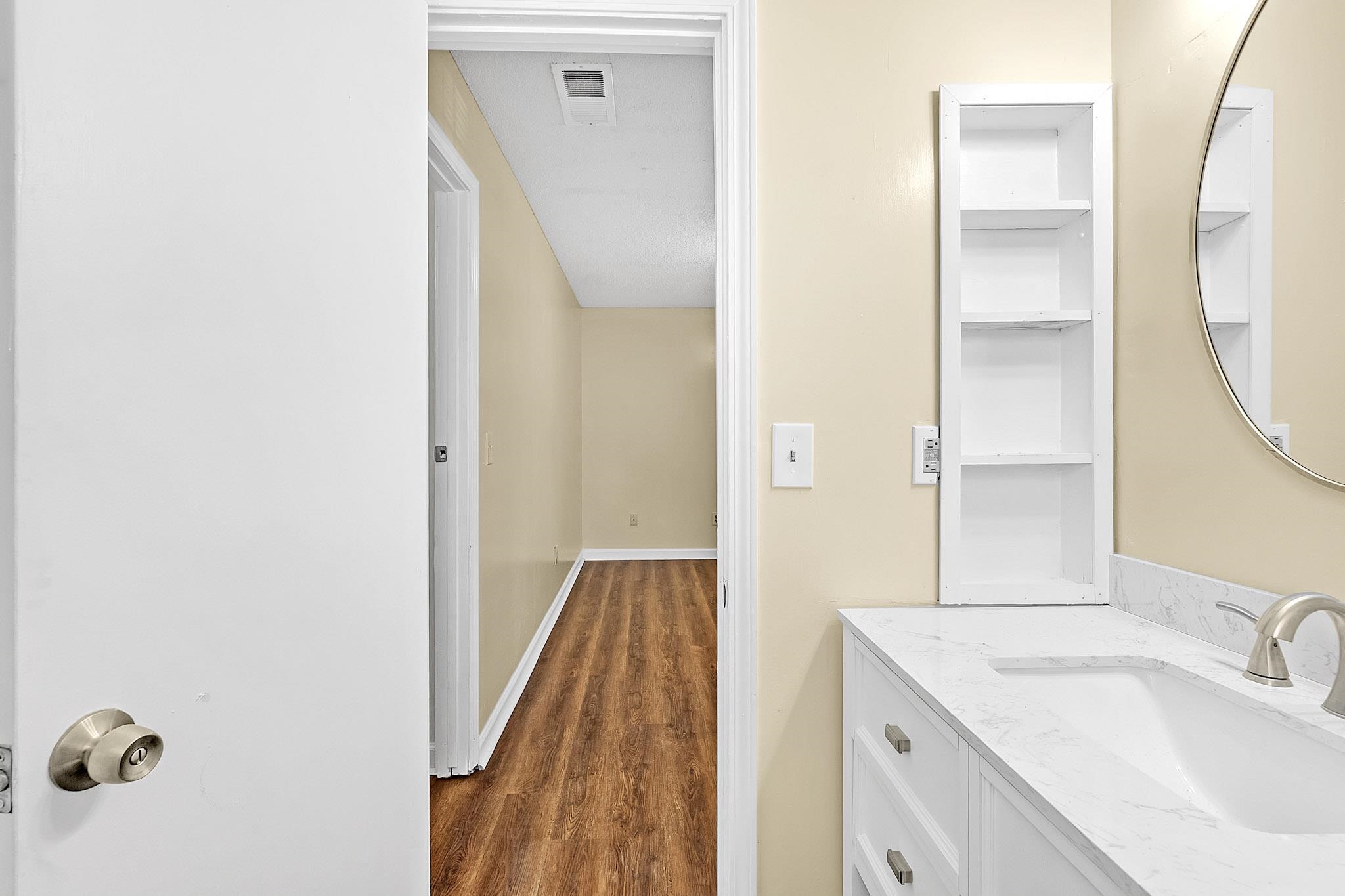 2955 Lake Park Road Memphis, TN 38127 - Photo 12 of 26 a bathroom with a sink and a mirror