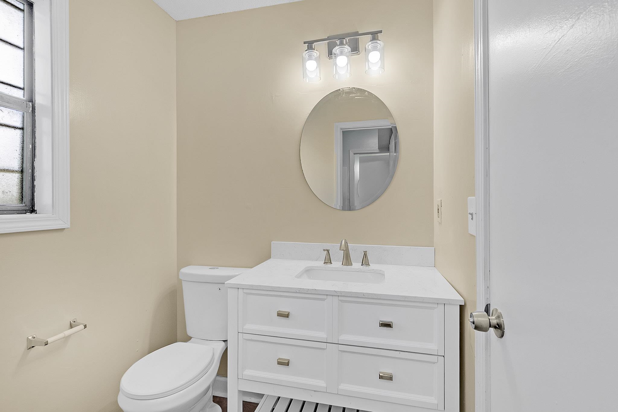 2955 Lake Park Road Memphis, TN 38127 - Photo 13 of 26 a bathroom with a toilet sink and mirror