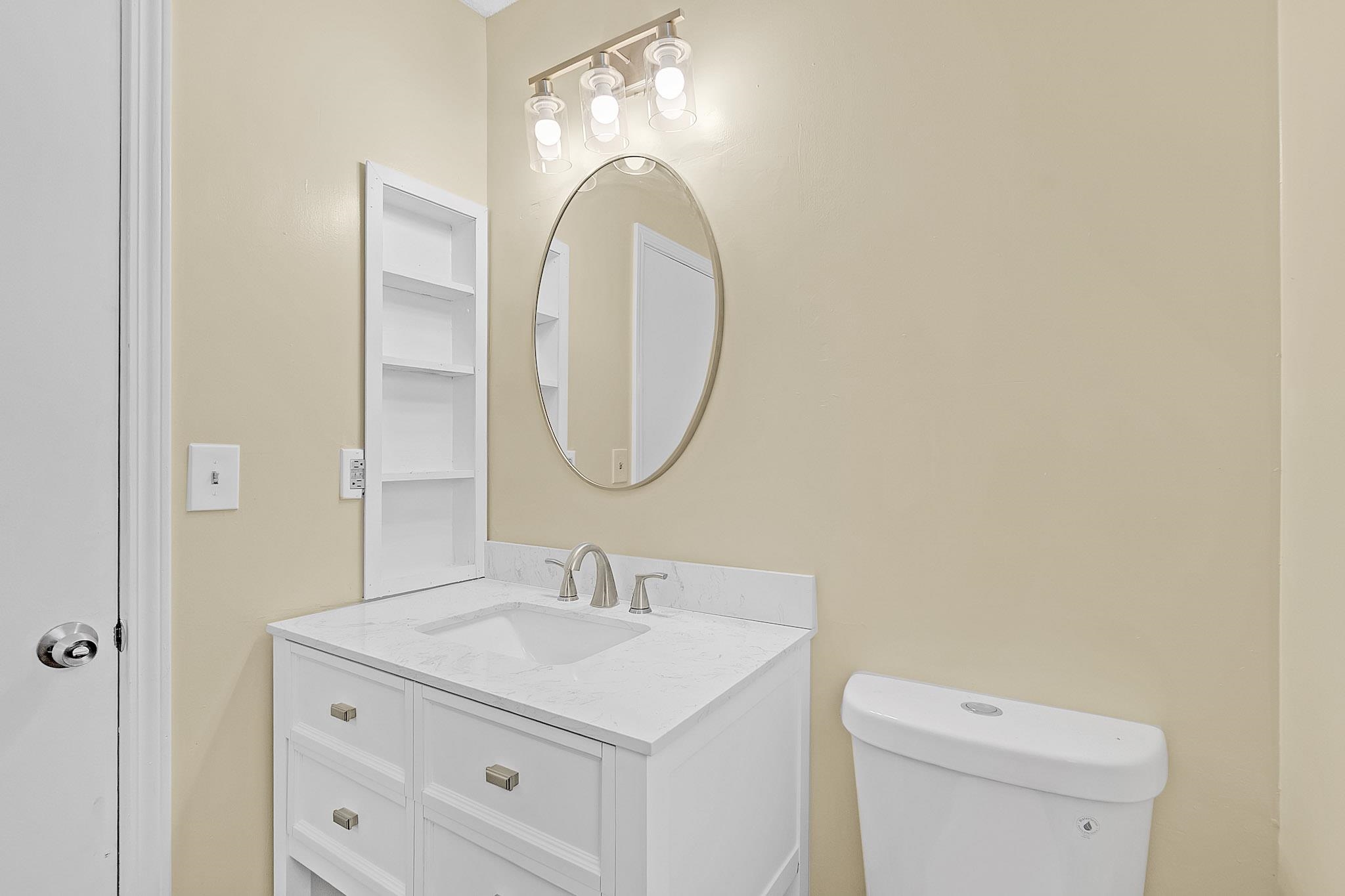 2955 Lake Park Road Memphis, TN 38127 - Photo 14 of 26 a bathroom with a sink and a mirror