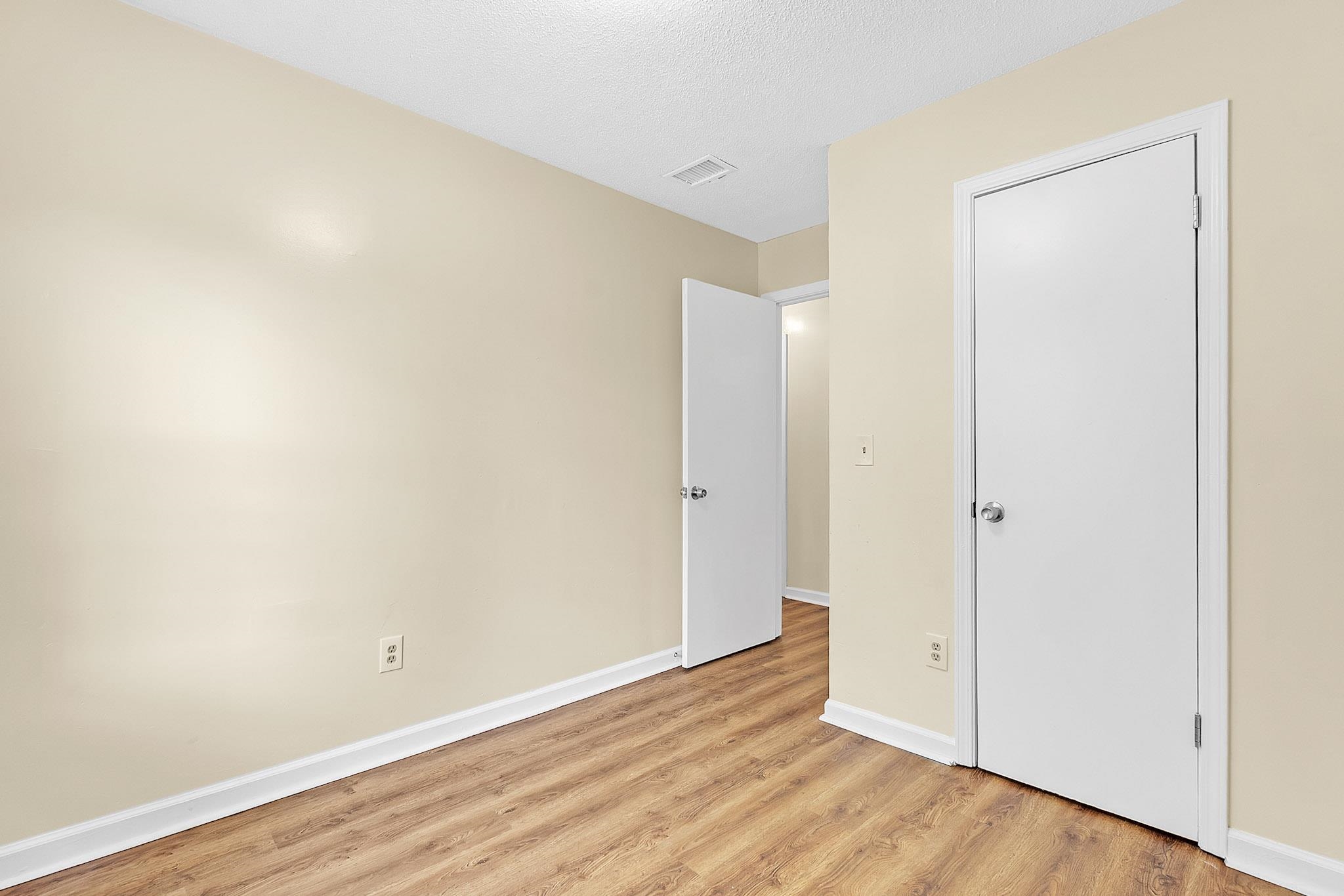 2955 Lake Park Road Memphis, TN 38127 - Photo 17 of 26 a view of an empty room with wooden floor