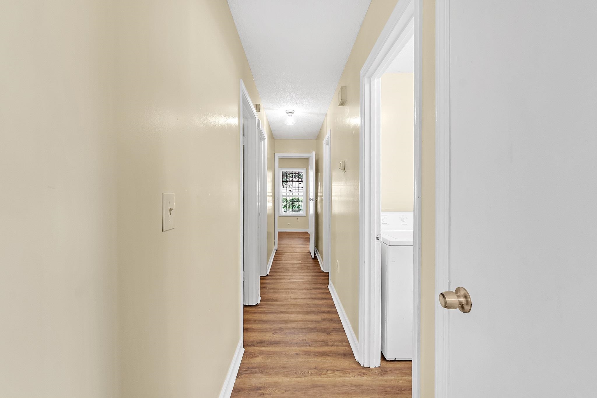 2955 Lake Park Road Memphis, TN 38127 - Photo 23 of 26 a view of a hallway with wooden floor and staircase