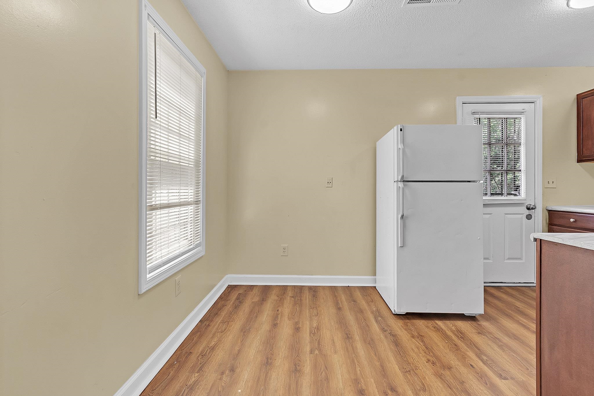 2955 Lake Park Road Memphis, TN 38127 - Photo 6 of 26 a view of a room with wooden floor and a window
