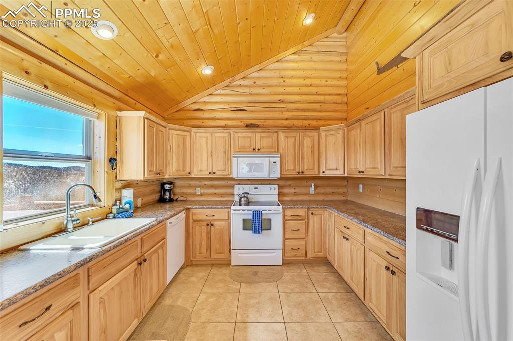 17549 Highway 67 Divide, CO 80814 - Photo 14 of 46 a kitchen with stainless steel appliances a sink window and cabinets