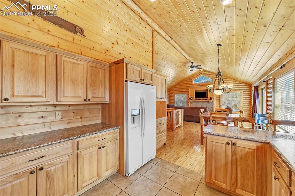 17549 Highway 67 Divide, CO 80814 - Photo 17 of 46 a kitchen with stainless steel appliances granite countertop a refrigerator and cabinets