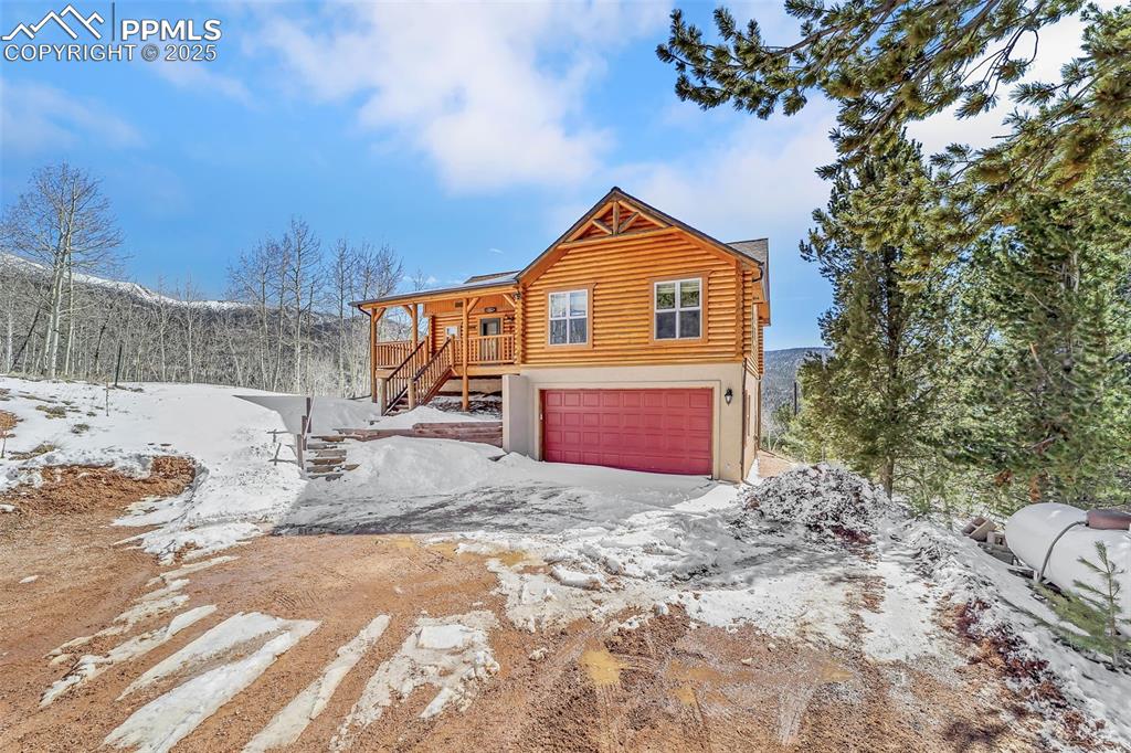 17549 Highway 67 Divide, CO 80814 - Photo 2 of 46 a view of a house with a yard