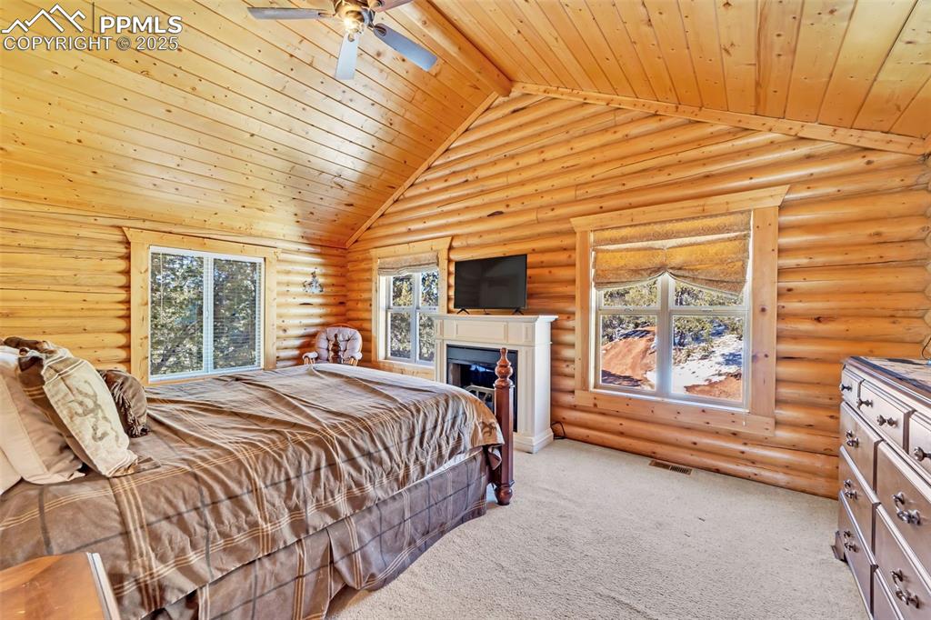 17549 Highway 67 Divide, CO 80814 - Photo 23 of 46 a bed sitting in a spacious bedroom next to a window