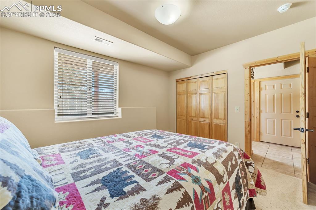 17549 Highway 67 Divide, CO 80814 - Photo 29 of 46 a bedroom with a bed and a window