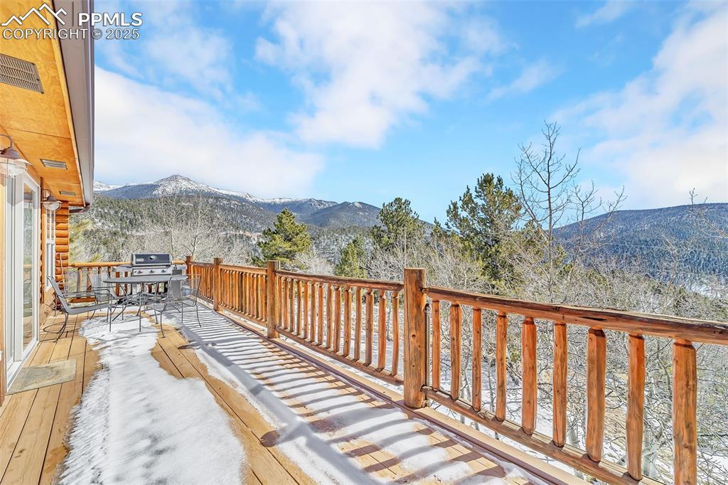 17549 Highway 67 Divide, CO 80814 - Photo 35 of 46 a balcony with wooden floor and city view