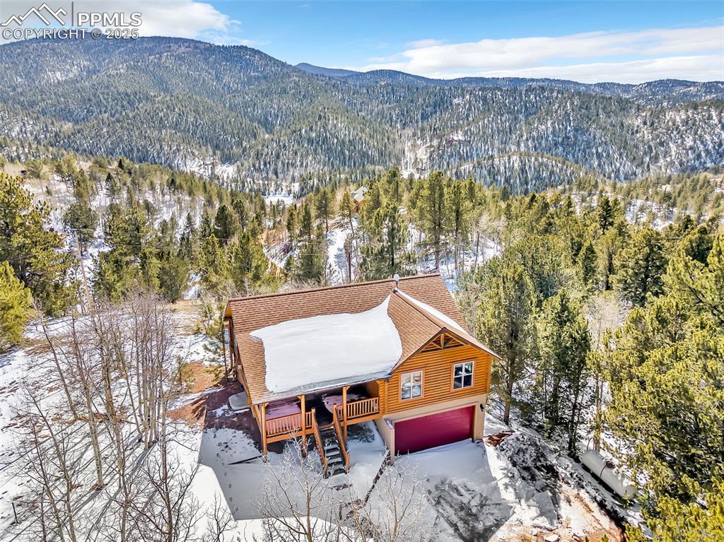 17549 Highway 67 Divide, CO 80814 - Photo 40 of 46 a aerial view of a house with a yard and lake view