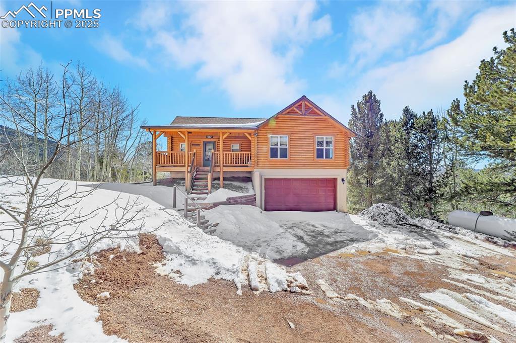 17549 Highway 67 Divide, CO 80814 - Photo 4 of 46 a view of a house with a yard covered in snow