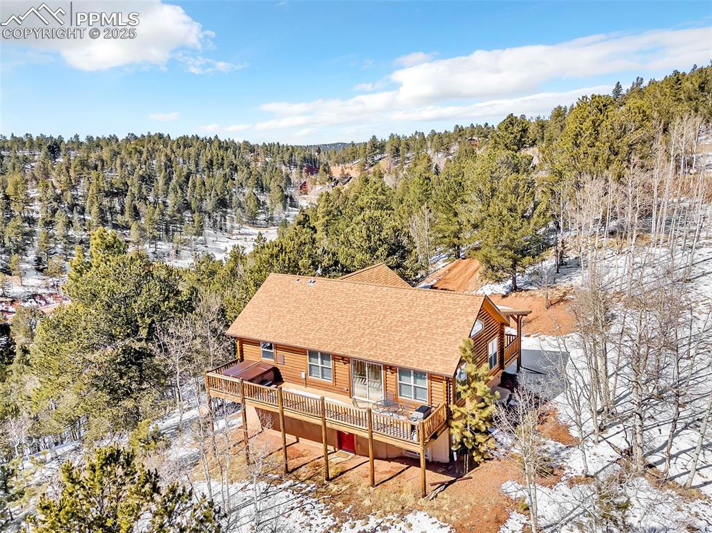 17549 Highway 67 Divide, CO 80814 - Photo 42 of 46 a view of a terrace with a bench and chairs