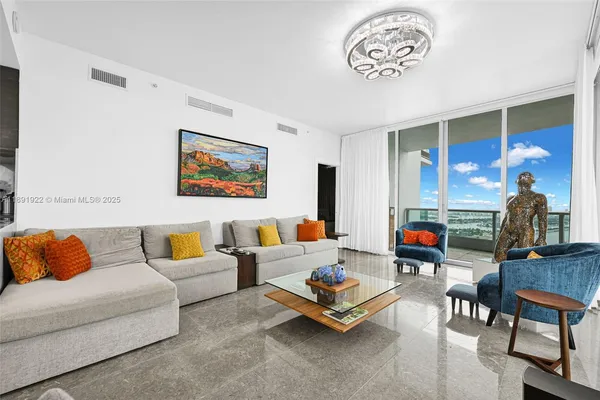 a living room with furniture and a table