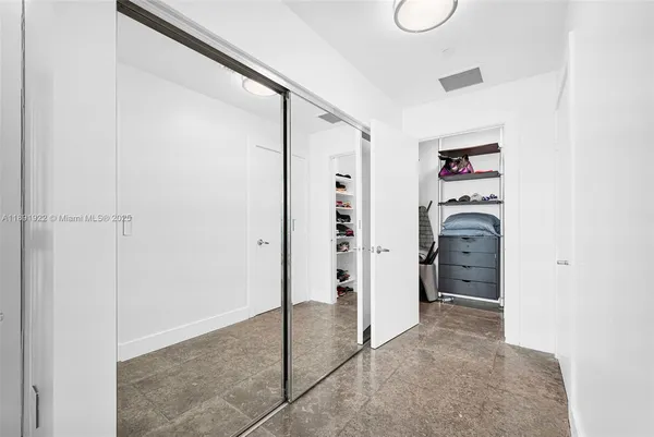 a view of livingroom with walk in closet and window