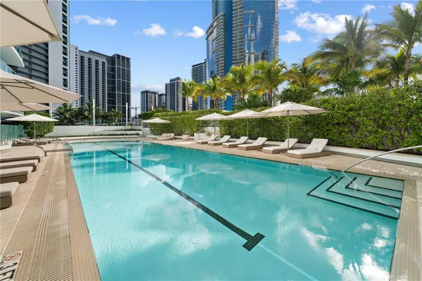 a view of a swimming pool with a patio