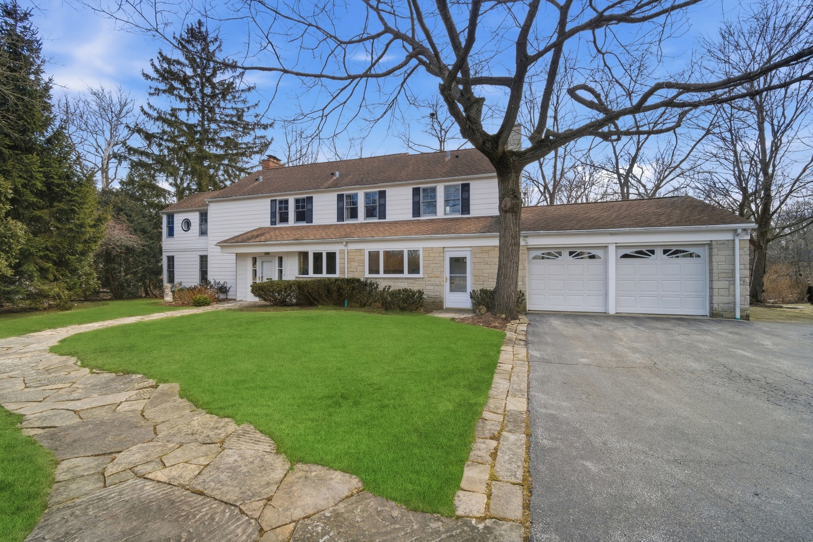 front view of a house with a yard