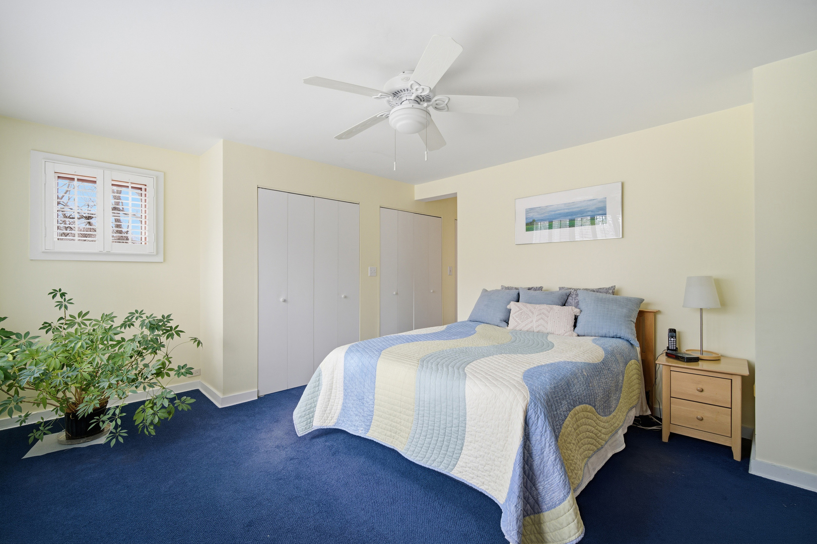 200 Braeburn Road Highland Park, IL 60035 - Photo 16 of 30 a bedroom with a bed and a chandelier