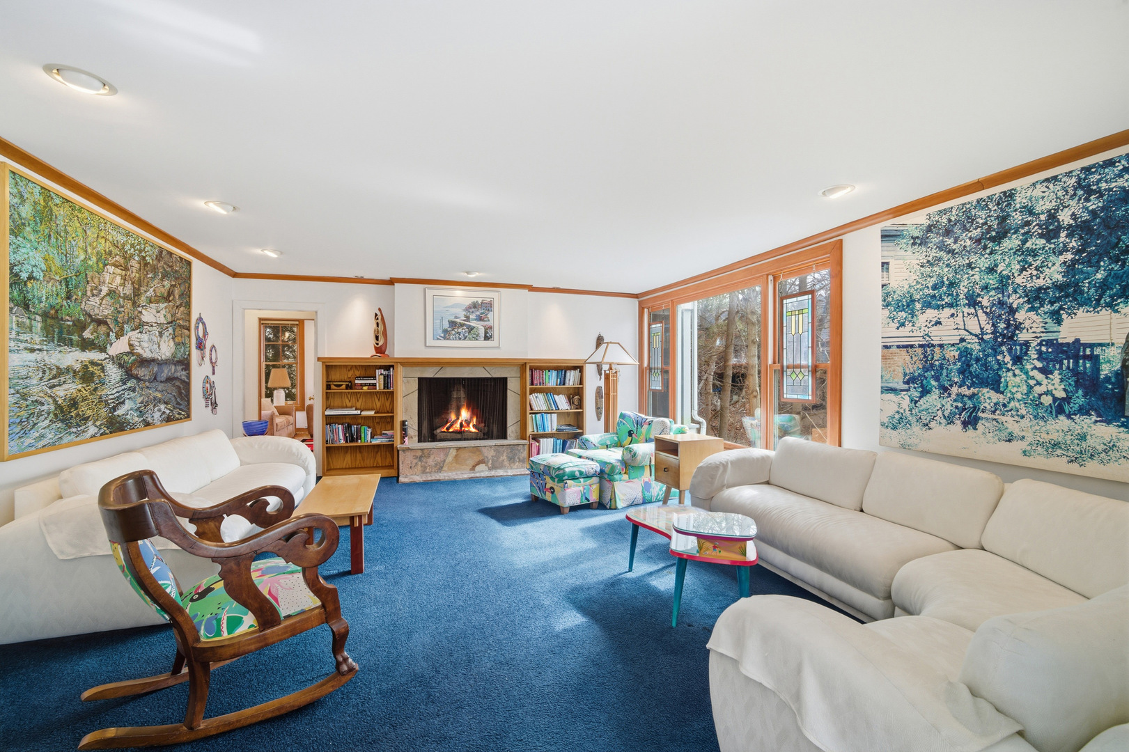 200 Braeburn Road Highland Park, IL 60035 - Photo 2 of 30 a living room with furniture a fireplace and a floor to ceiling window