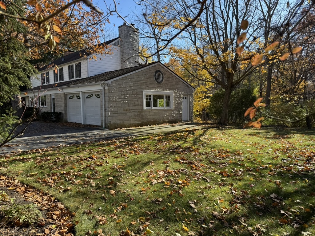 200 Braeburn Road Highland Park, IL 60035 - Photo 25 of 30 a house with trees in front of it