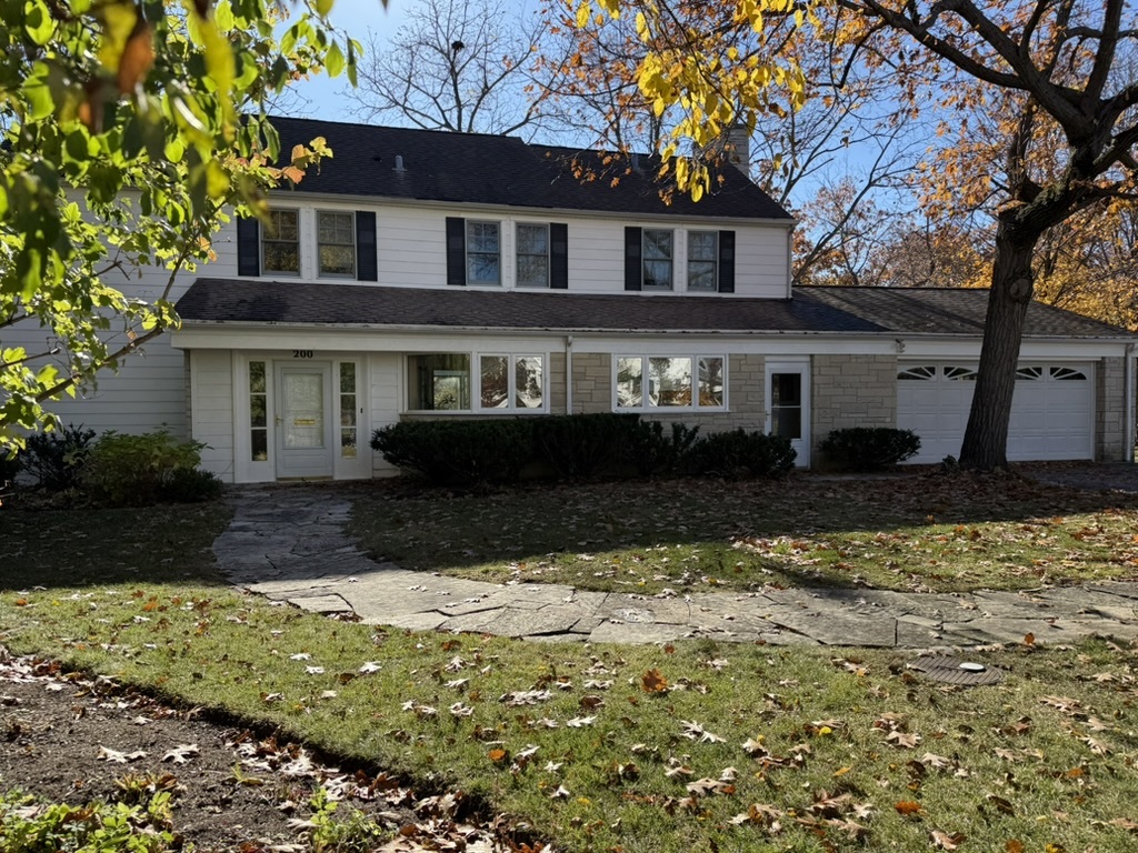 200 Braeburn Road Highland Park, IL 60035 - Photo 26 of 30 a front view of a house with a yard