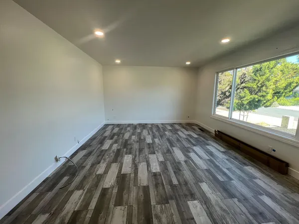 a view of wooden floor in an empty room