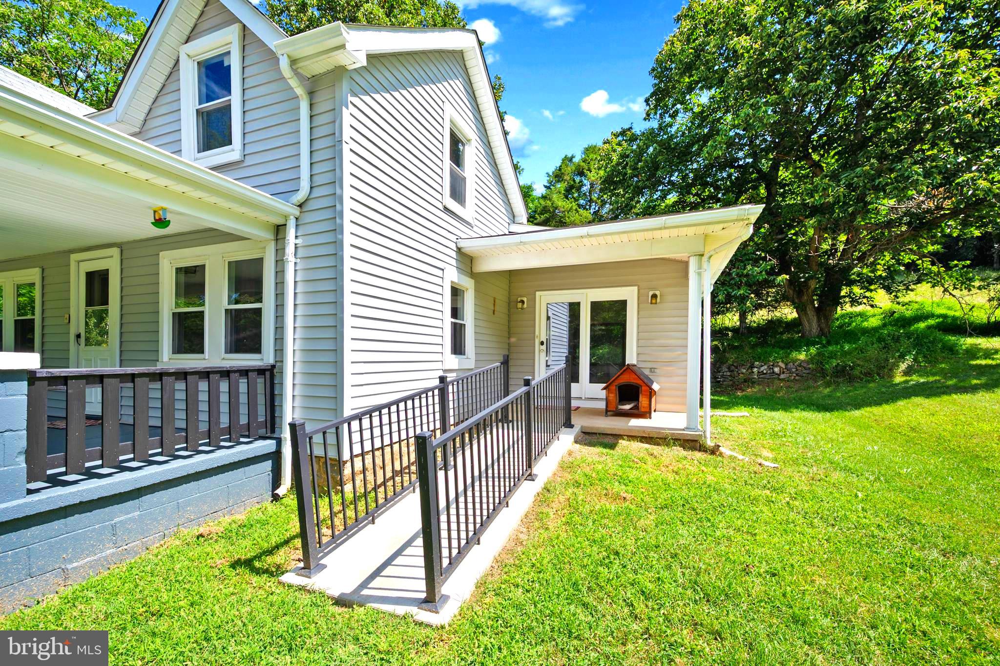 145 Weakley Lane Stanley, VA 22851 - Photo 21 of 27 a view of a house with a small yard and a large tree