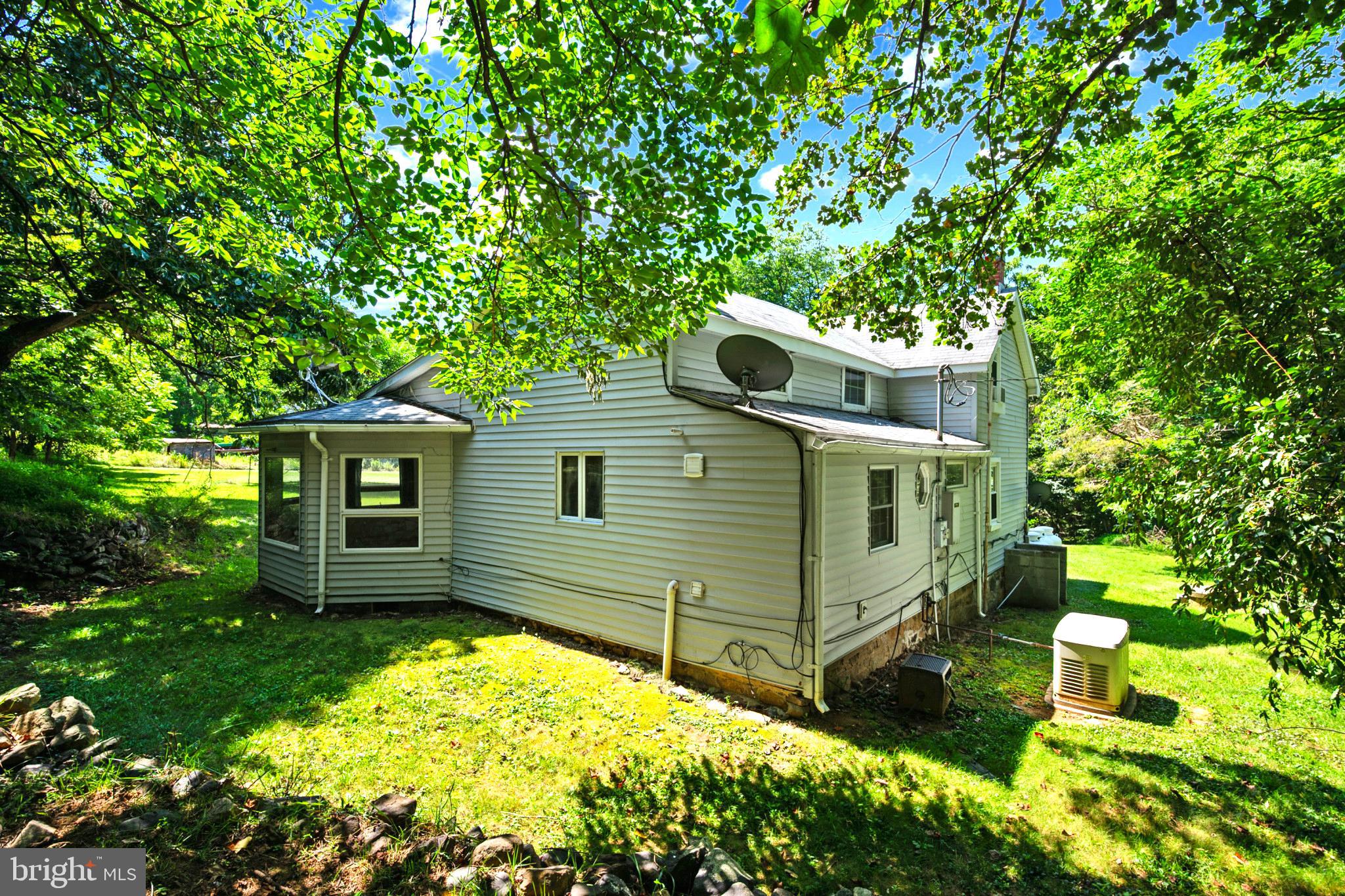 145 Weakley Lane Stanley, VA 22851 - Photo 25 of 27 a backyard of a house with yard and outdoor seating